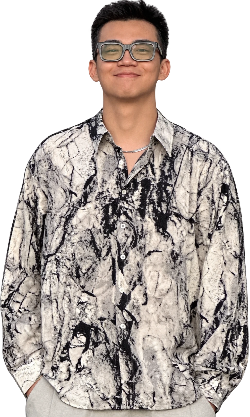 Portrait of Haomin Yang wearing glasses and a black-and-white patterned shirt