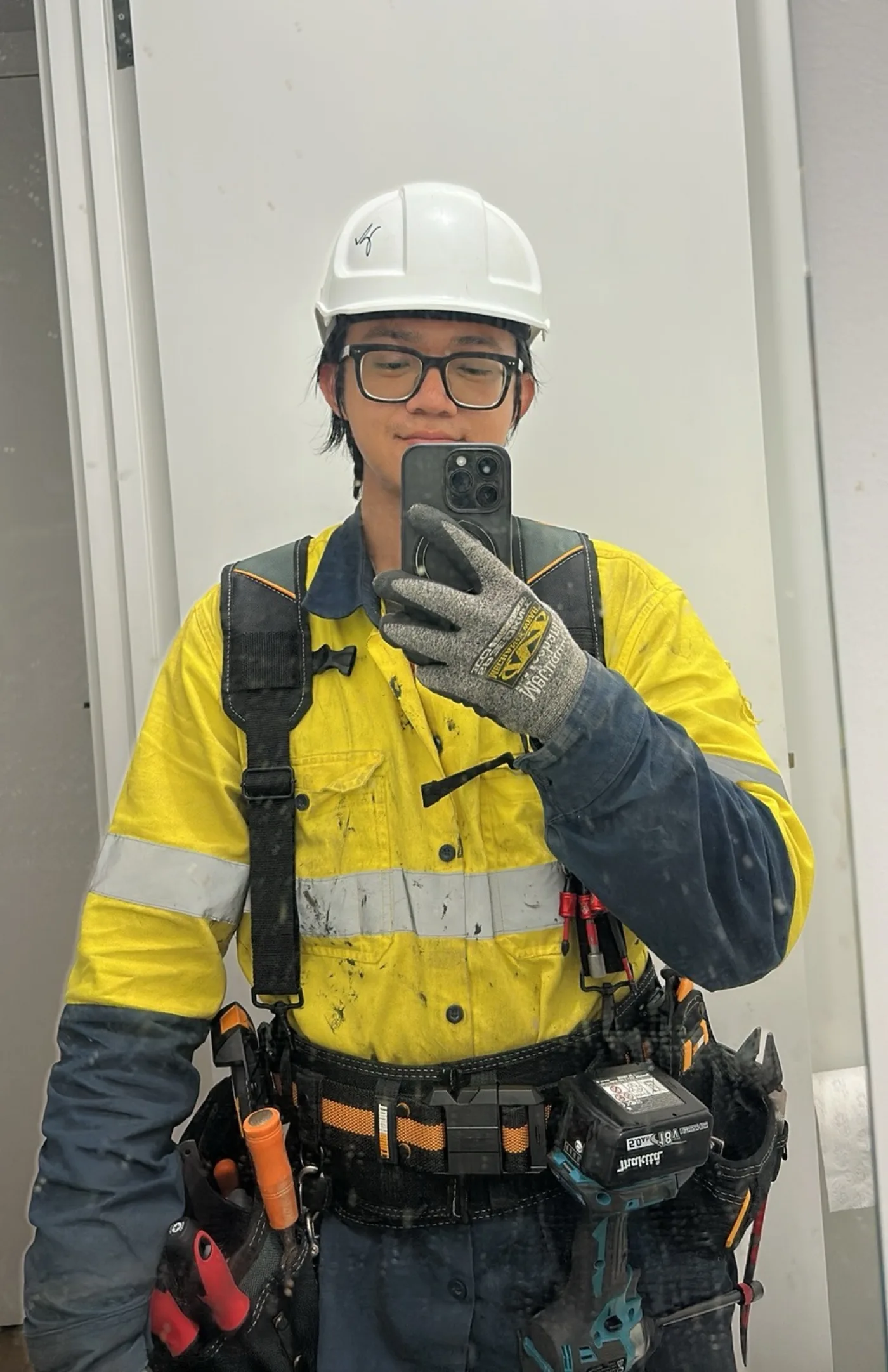 Haomin Yang in personal protective equipment on a construction site