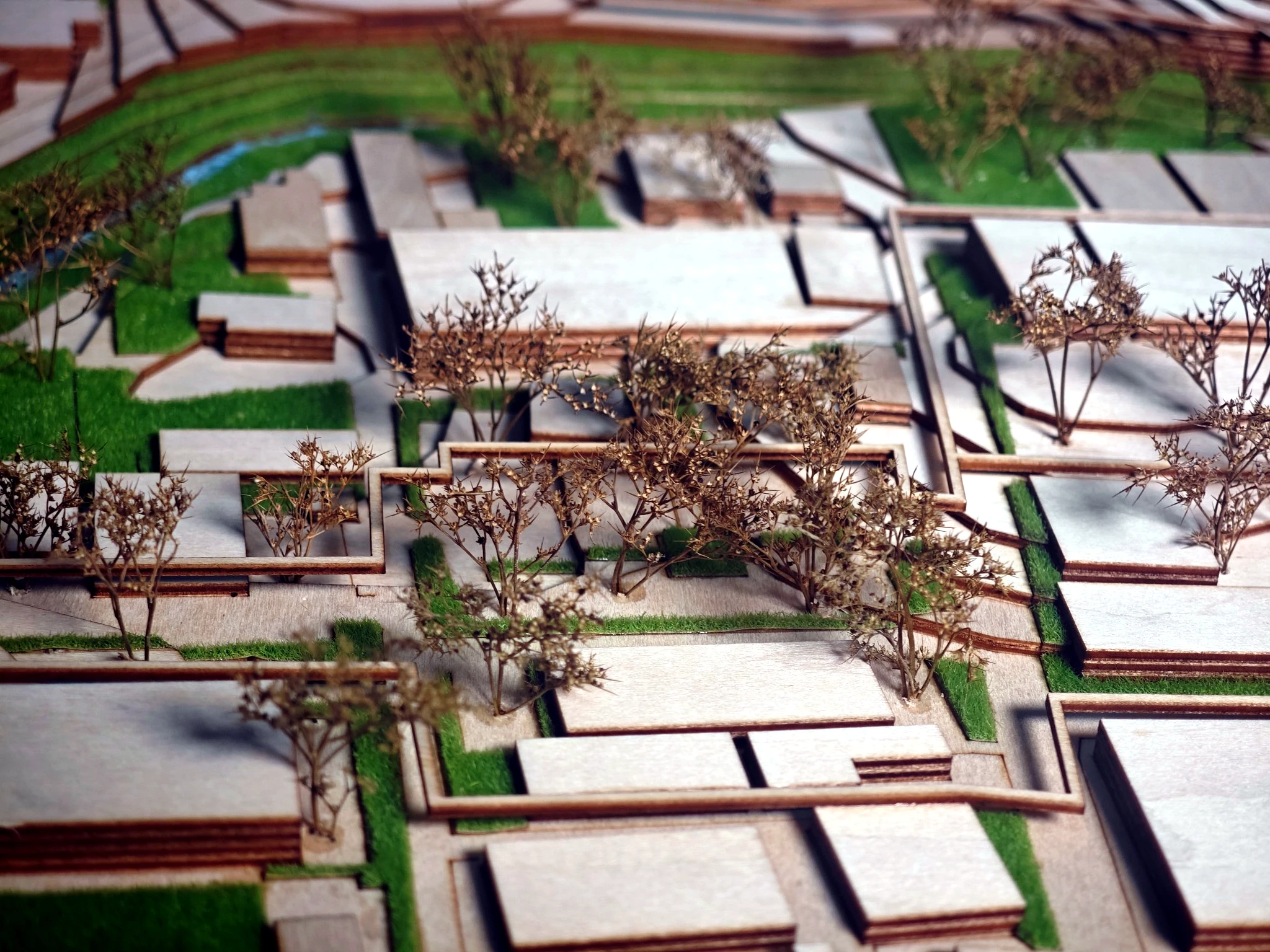 Physical model detail showing planted terraces and urban fabric